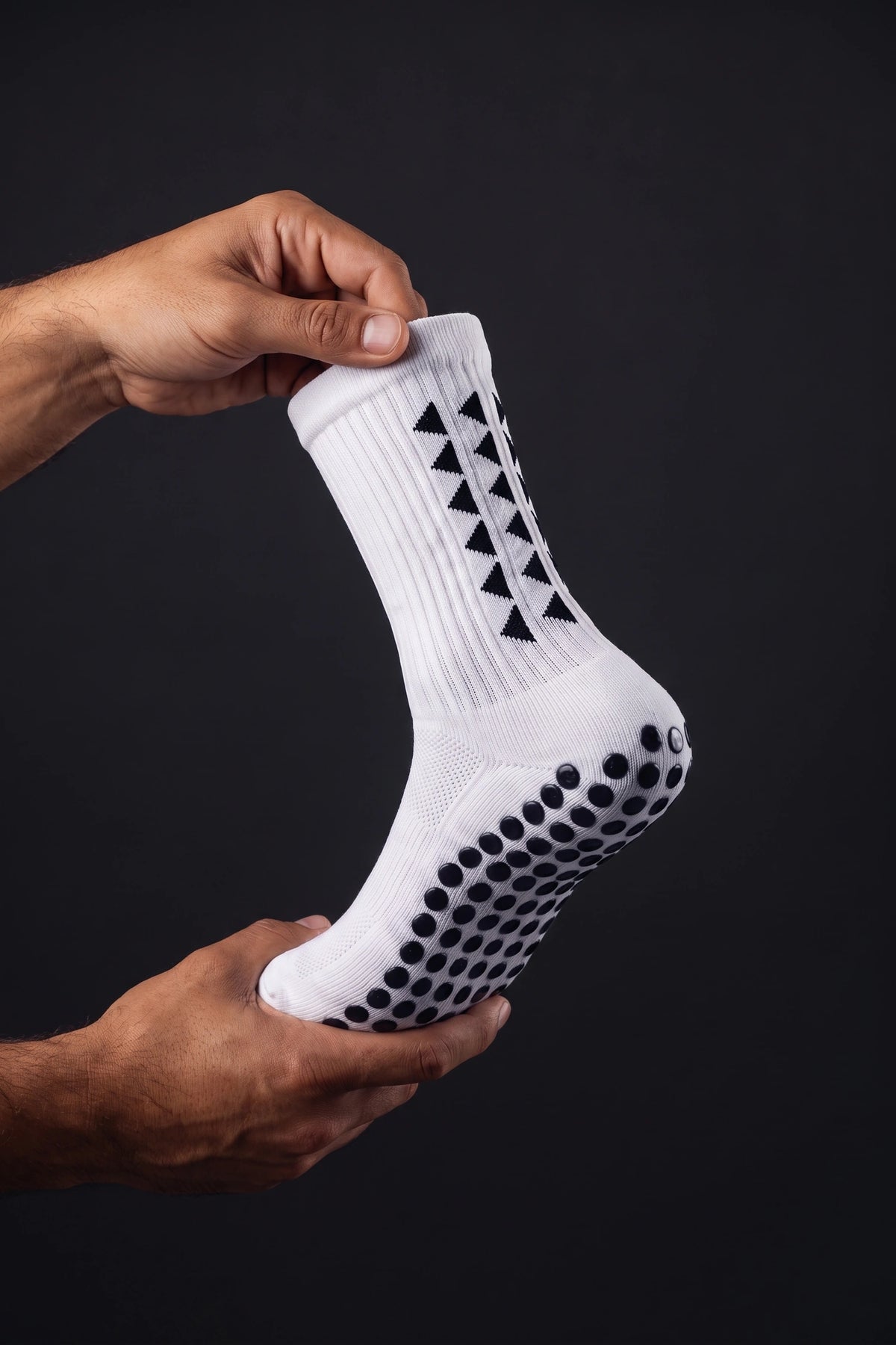 Gros plan sur la maille et les picots de la chaussette Grip Pro